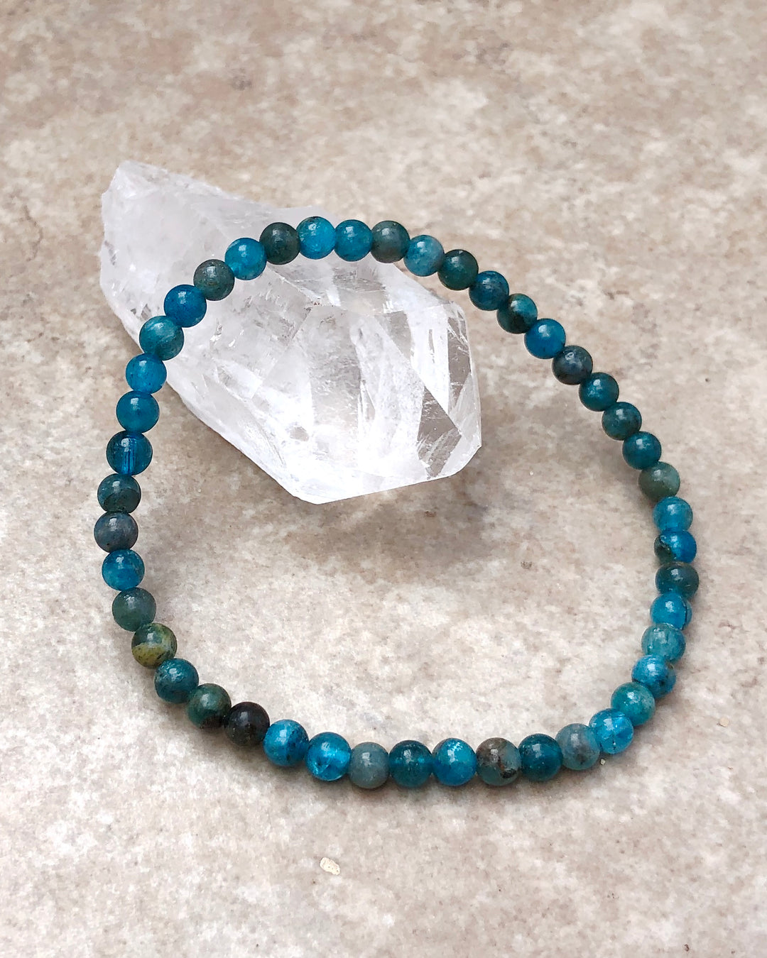 Apatite 4mm Beaded Gemstone Bracelet on a crystal
