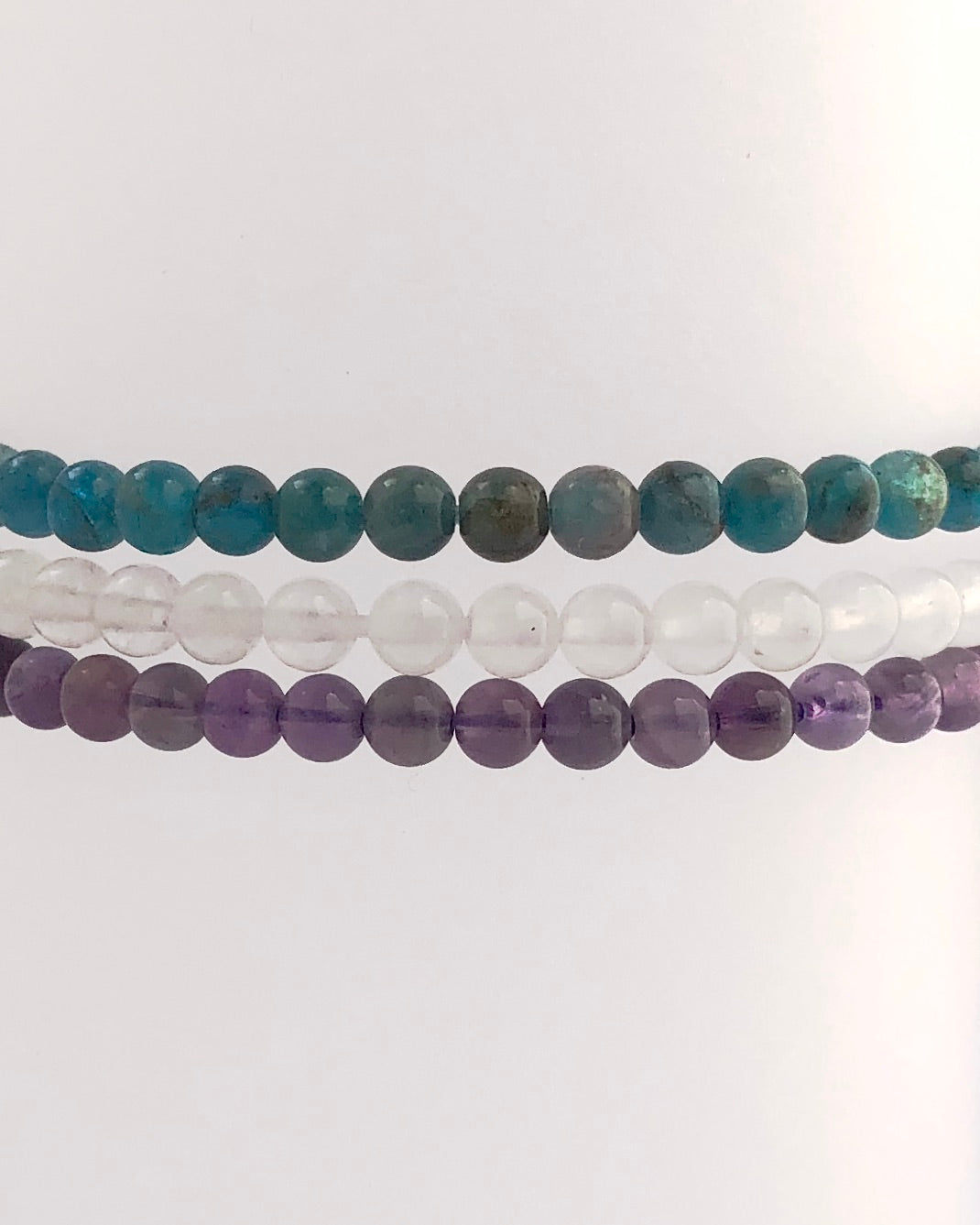 Amethyst, Snow Quartz and Apatite 4mm beaded Bracelets stacked.
