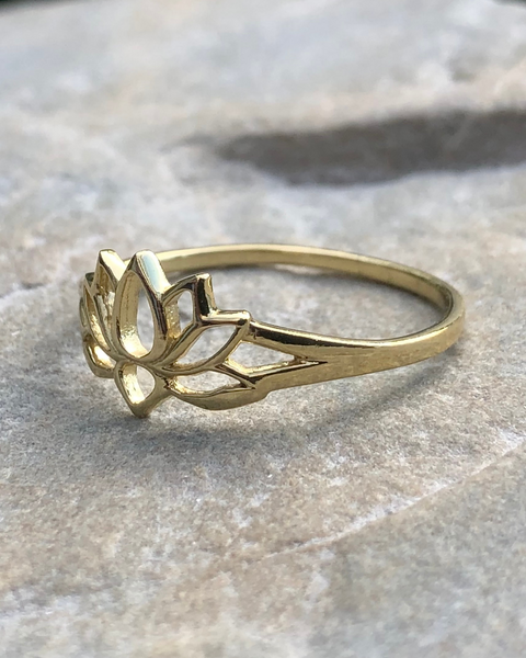 gold lotus ring on stone side view