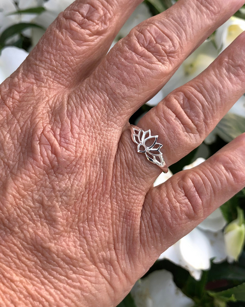 Sterling Silver Lotus Ring on right ring finger with white flowers 