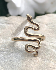 Adjustable Bronze Serpent Ring on stone