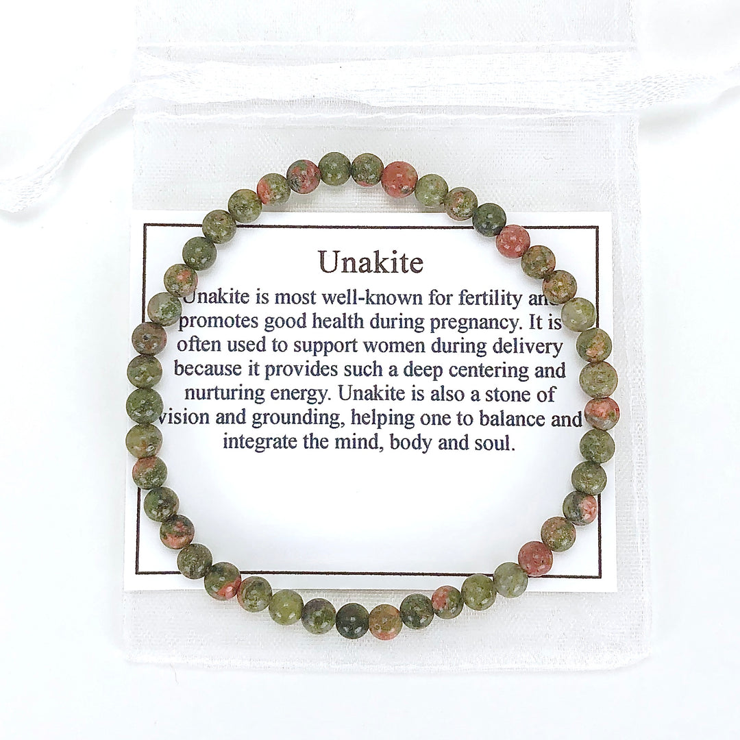 Unakite 4mm Beaded Gemstone Bracelet with a description card.