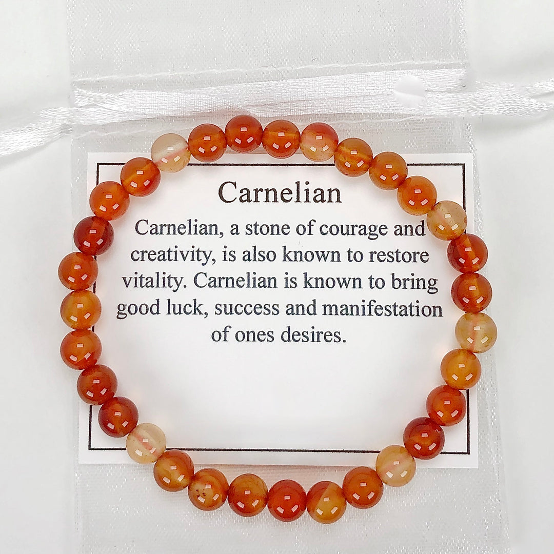 Carnelian 6mm Beaded Gemstone Bracelet with a description card.