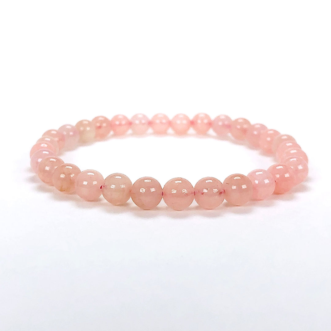 Morganite 6mm Beaded Gemstone Bracelet on a white background.