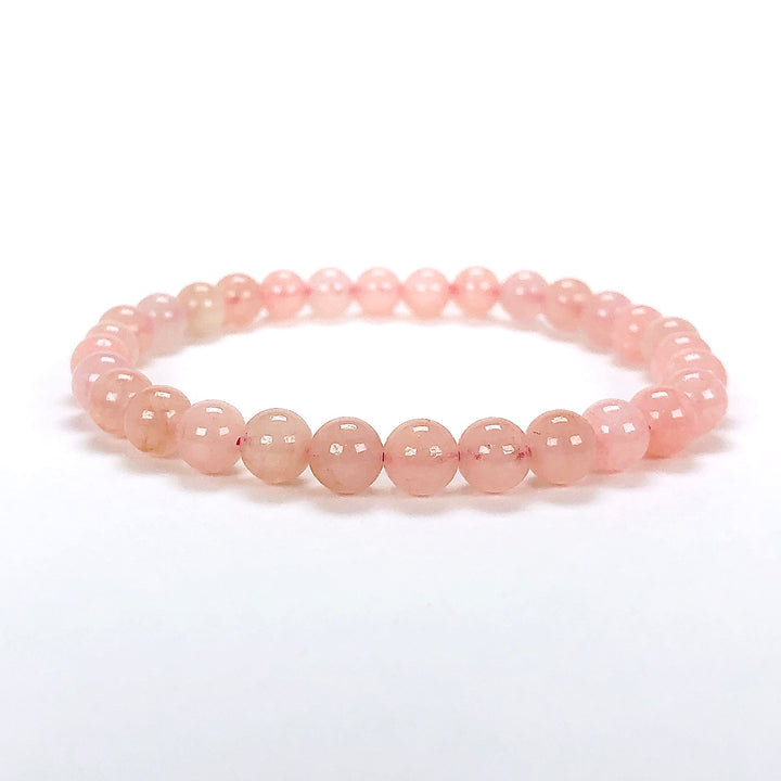 Morganite 6mm Beaded Gemstone Bracelet on a white background.