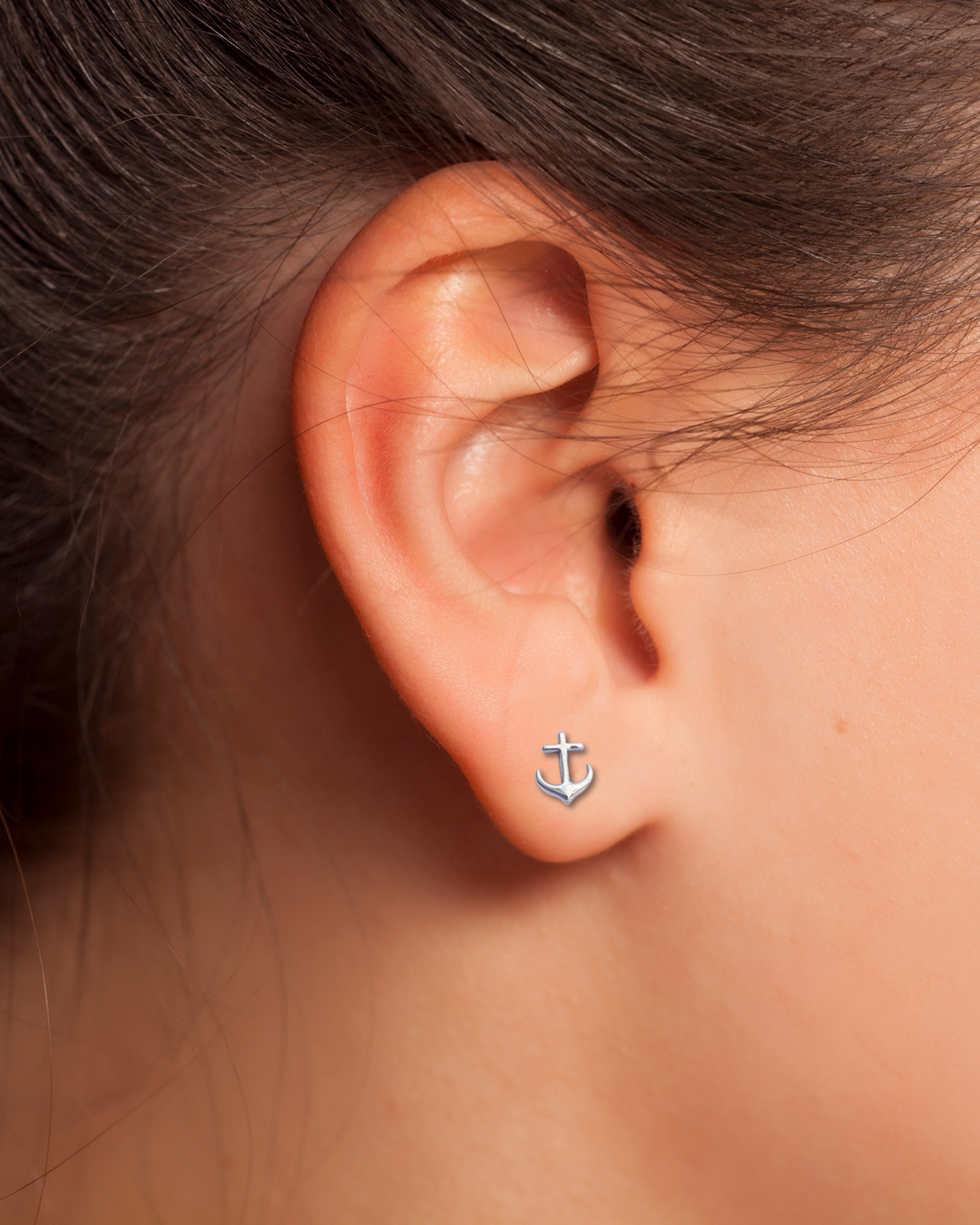 Anchor Silver Stud Earring on an Ear.