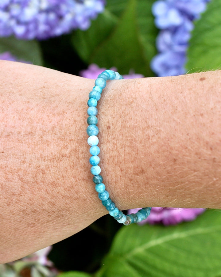 Apatite 4mm Gemstone Bracelet on a wrist.