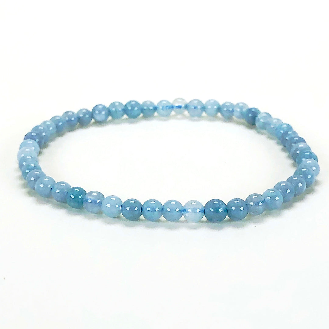 Aquamarine 4mm Beaded Gemstone Bracelet with white background.