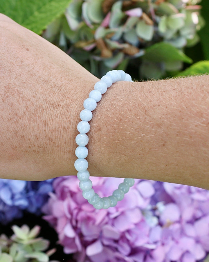 6mm Aquamarine Gemstone Bracelet on a wrist