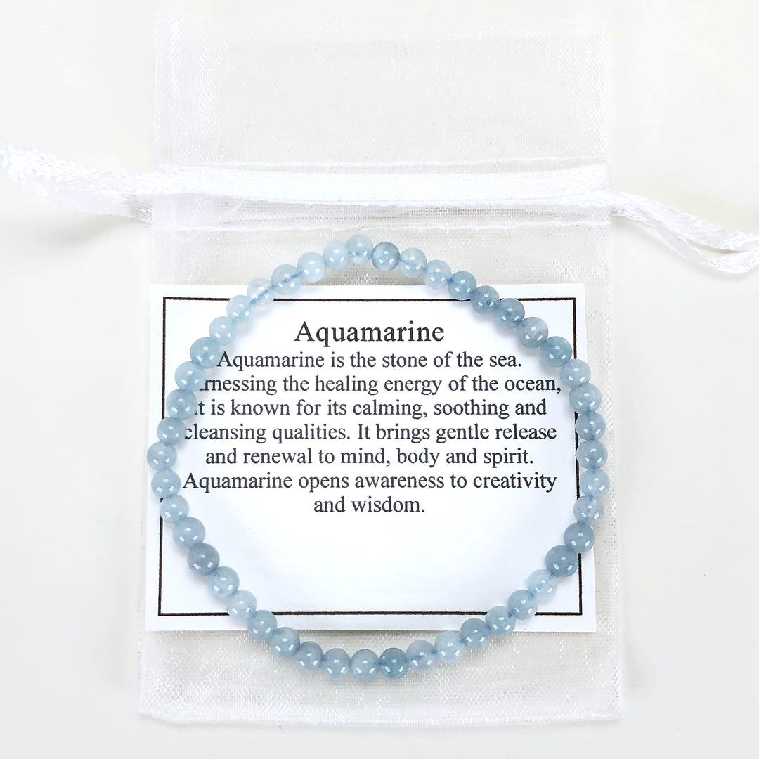 Men's Aquamarine 4mm Beaded Gemstone Bracelet with a description card