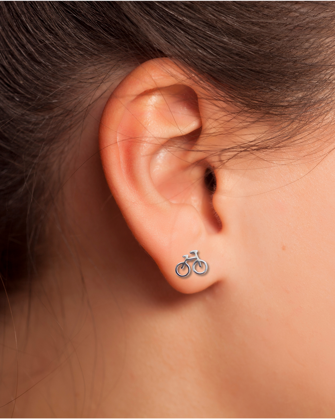 Bicycle Sterling Silver Stud Earrings on an ear