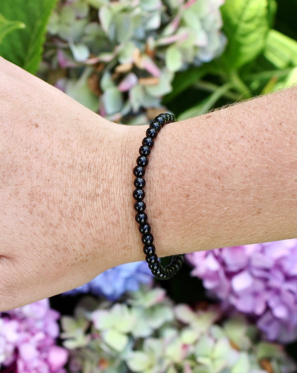 Black Tourmaline 4mm beaded gemstone Bracelet on a wrist