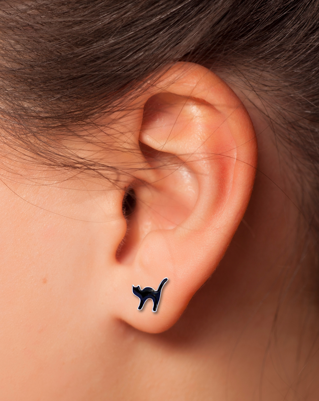 Black Cat Sterling Silver Stud Earring on an ear.