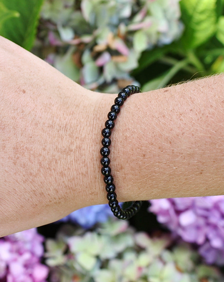 Children's Black Tourmaline 4mm Gemstone Bracelet on a Wrist