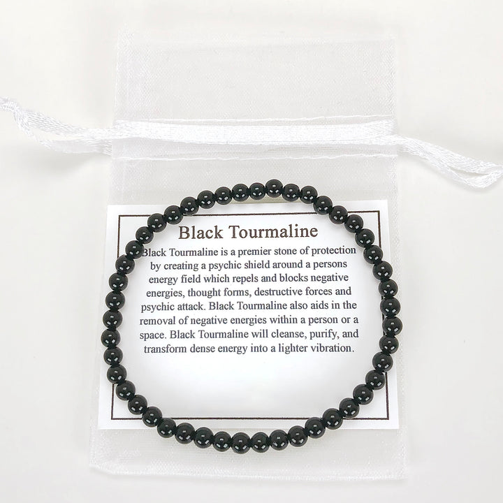 Men's Black Tourmaline 4mm Beaded Gemstone Bracelet with a description card