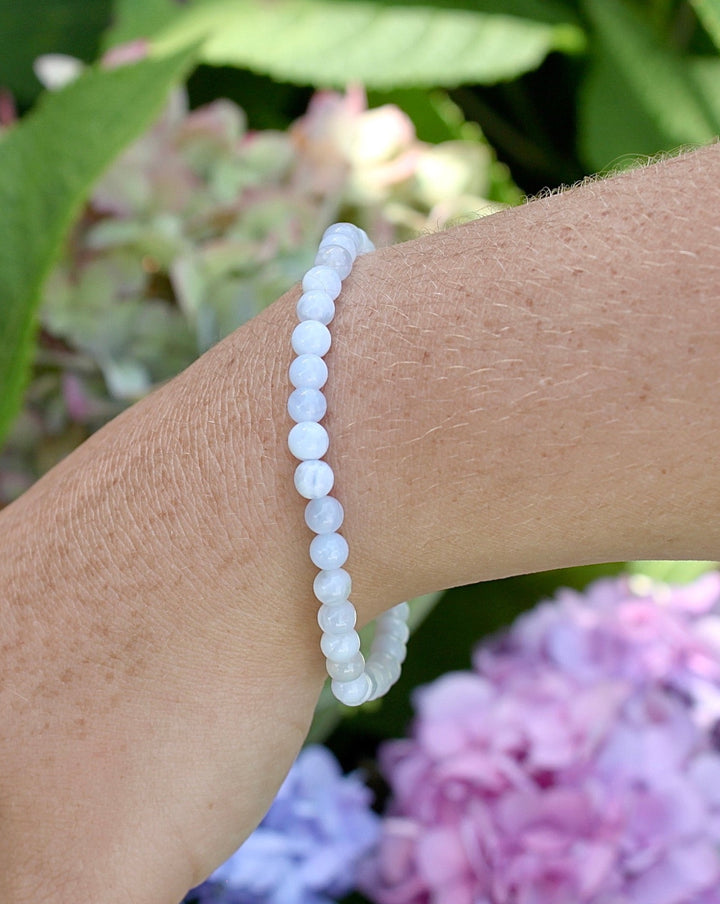 Blue Lace Agate 4mm Gemstone Bracelet on a Wrist.