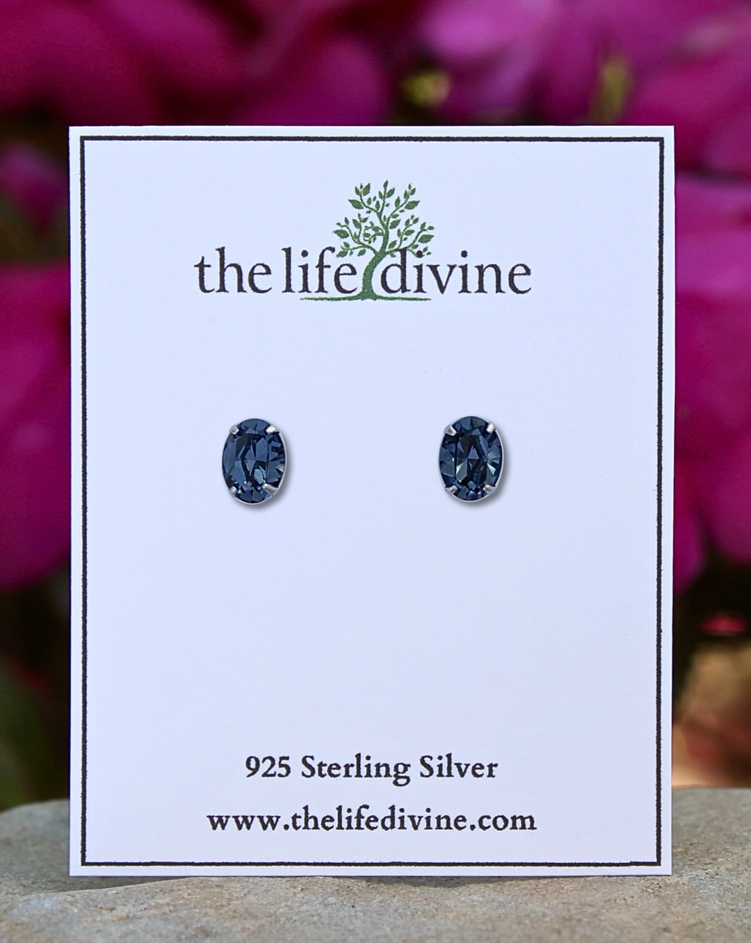 Blue Oval CZ Sterling Silver Earrings on a Card.