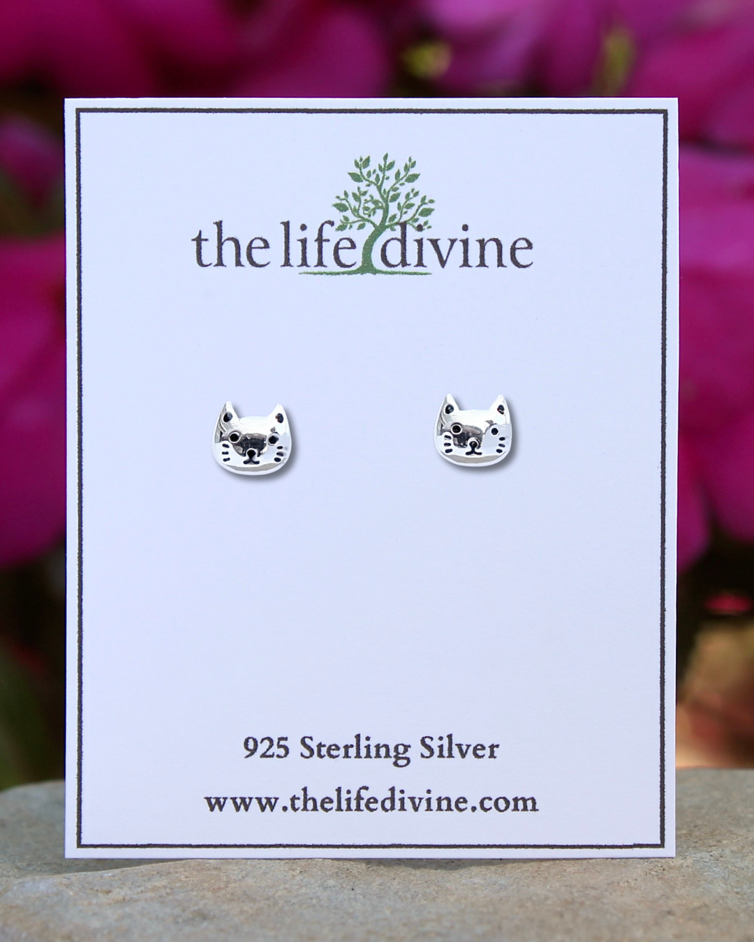 Cat Face Sterling Silver Stud Earrings on a car.