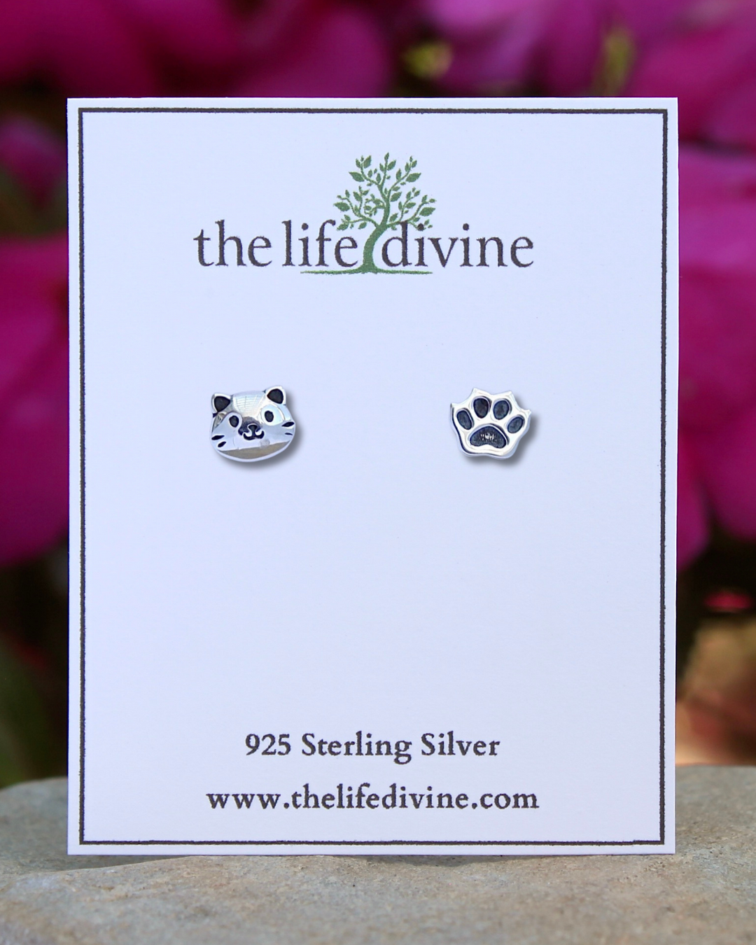 Cat Face and Paw Print Sterling Silver Stud Earrings on a card.