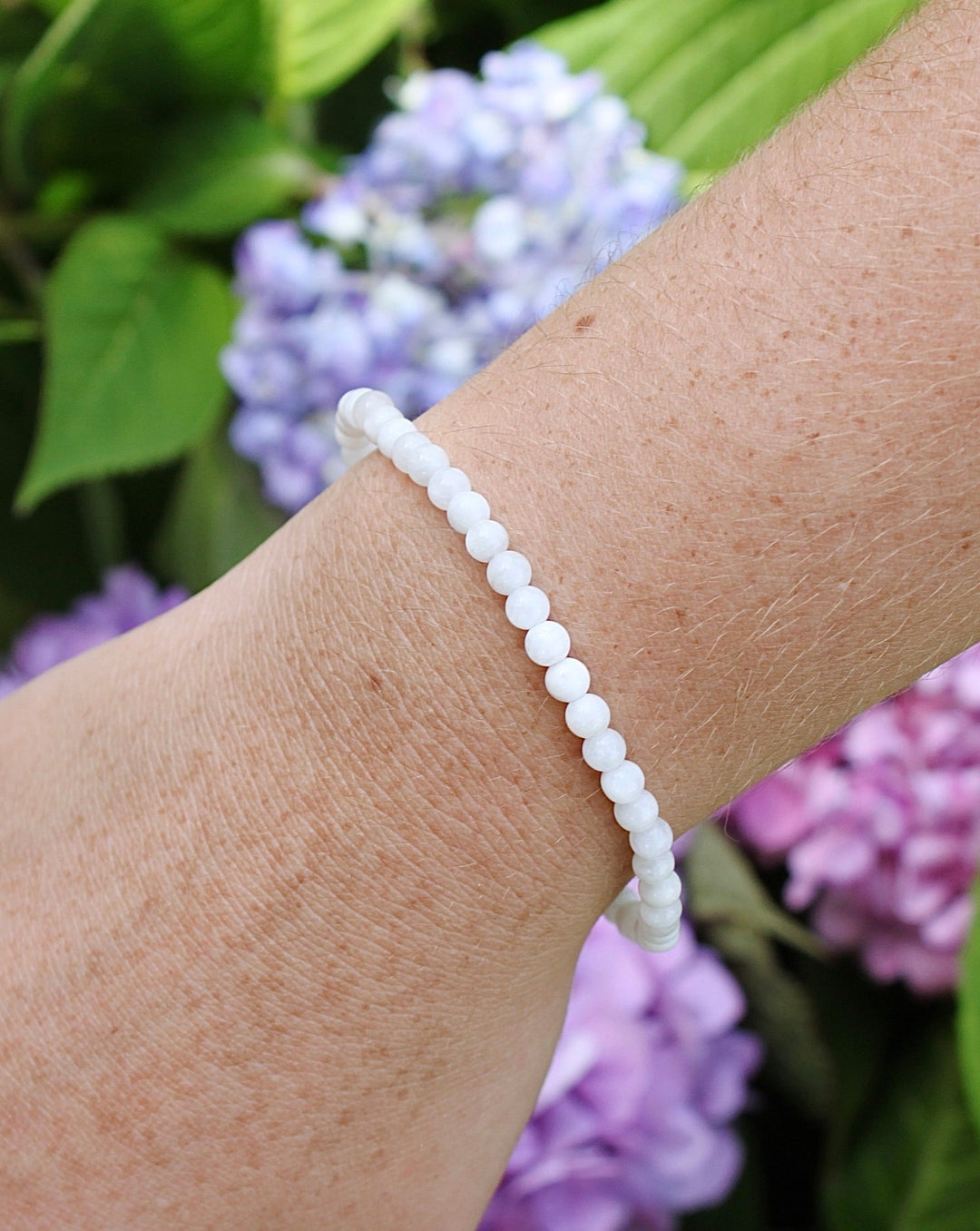 Children's Moonstone 4mm Gemstone Bracelet on a kid's wrist