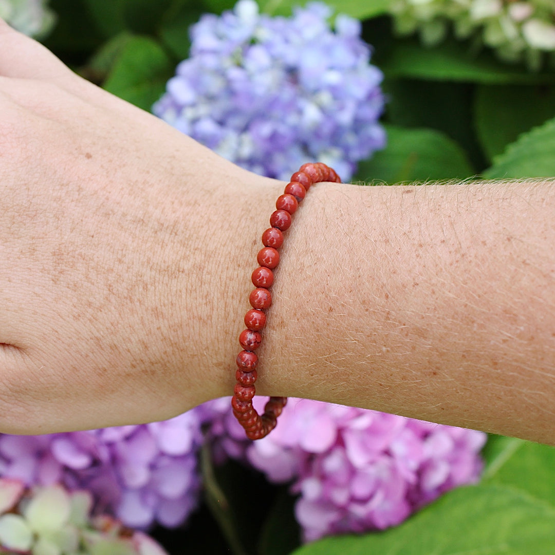 Children's Red Jasper 4mm Gemstone Bracelet on a wrist