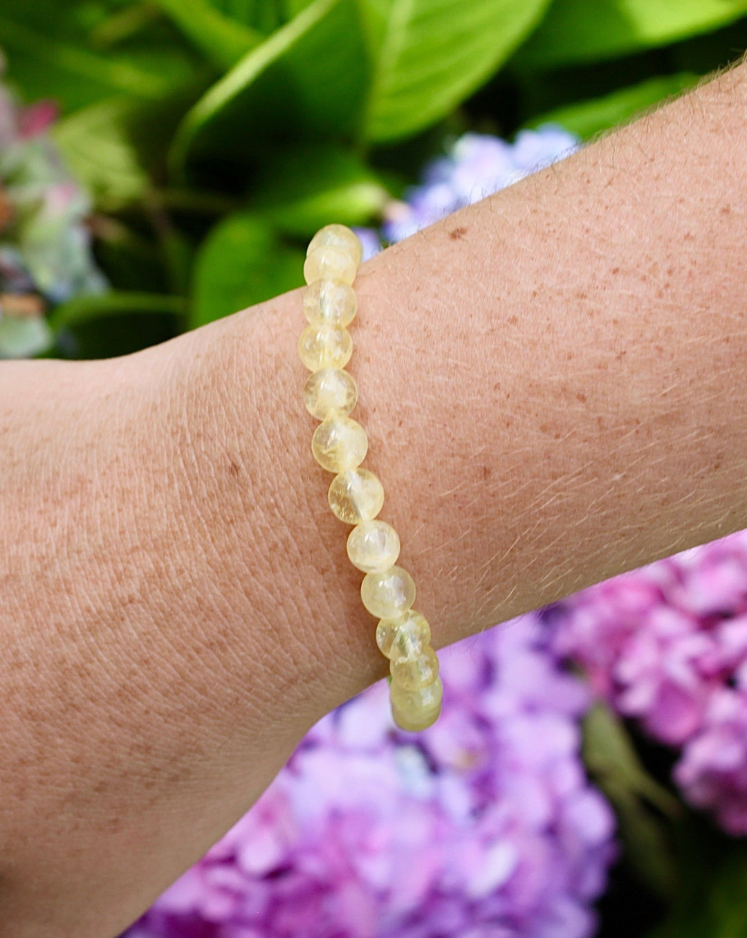 Citrine 6mm Beaded Gemstone Bracelet on a wrist.