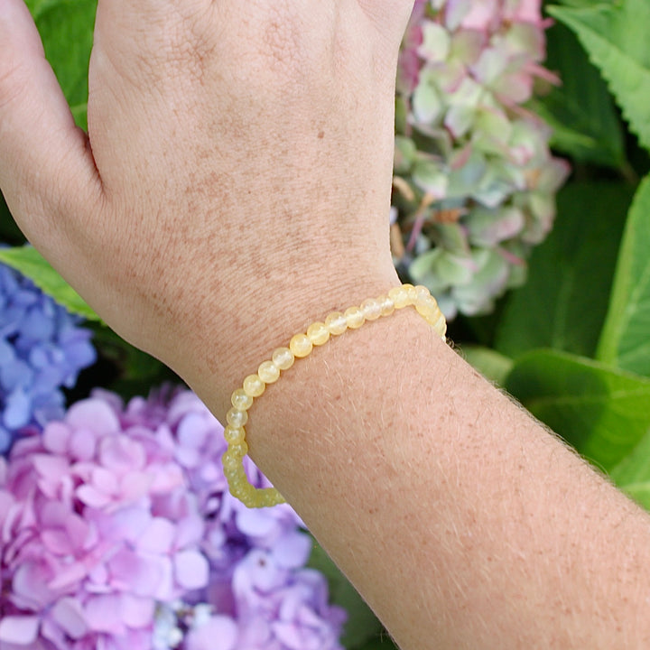 Citrine 4mm Gemstone Bracelet on a wist with flowers