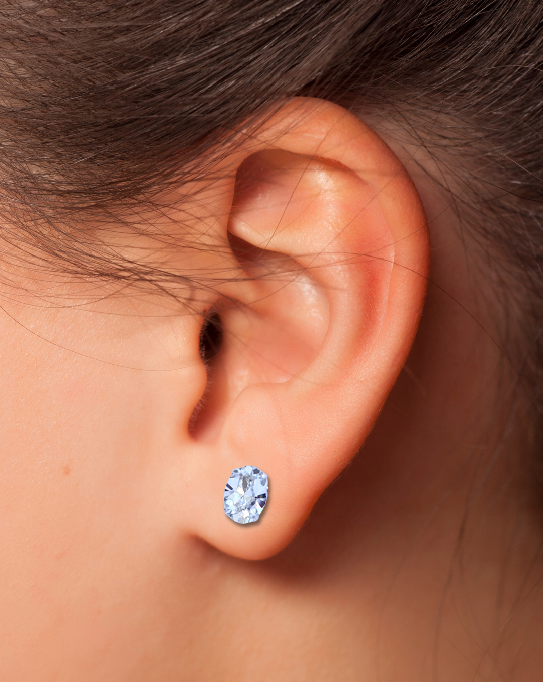 Clear Oval CZ Stud Earrings on ear