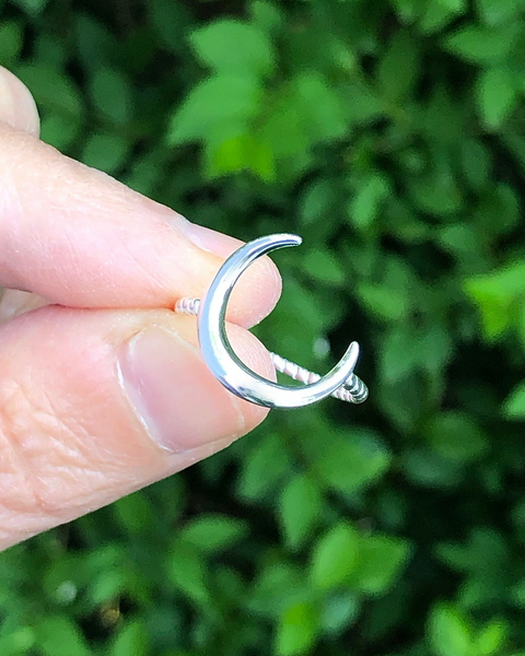 Sterling Silver Crescent moon ring with rope  between fingers 