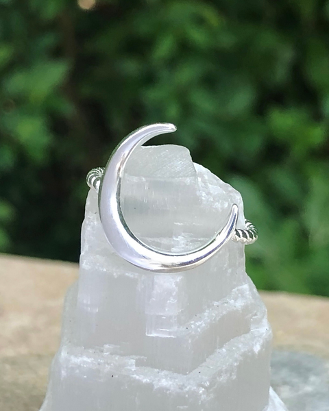 Sterling silver crescent moon with rope band on selenite