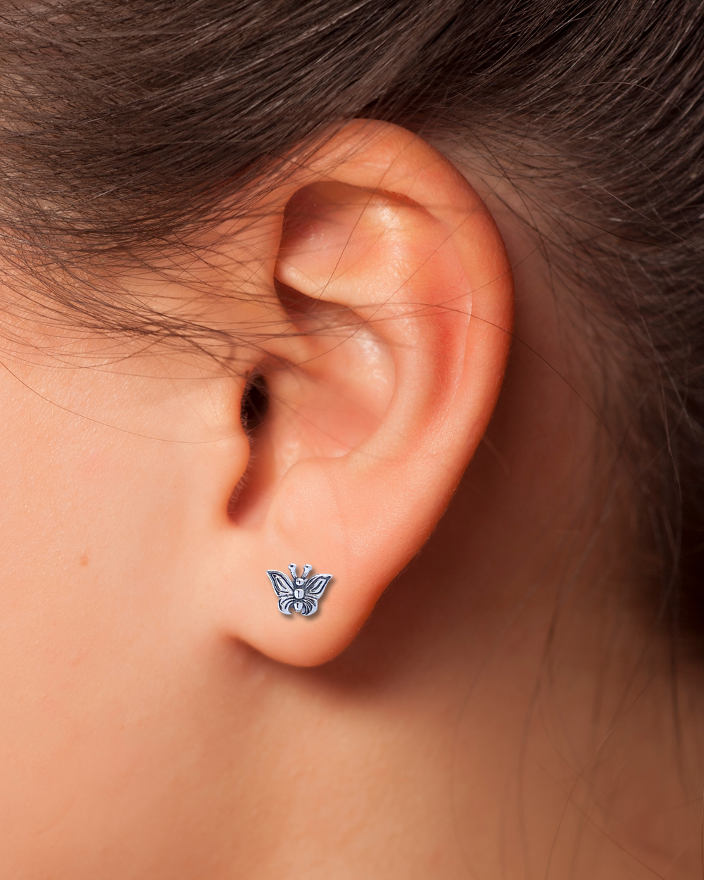 Detailed Butterfly Sterling Silver Earrings on ear