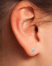 Tiny Nautical Knot Earring on a Women's Ear