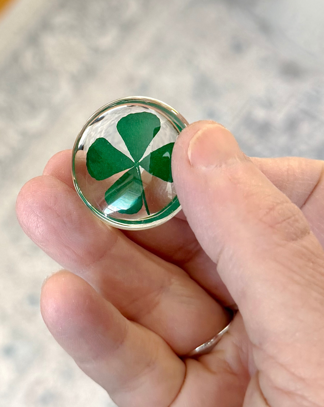 Holding A Four leaf Clover Stone