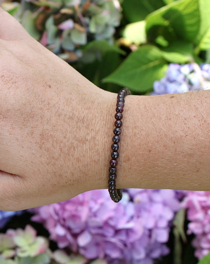 Garnet 4mm Beaded Gemstone Bracelet on a wrist