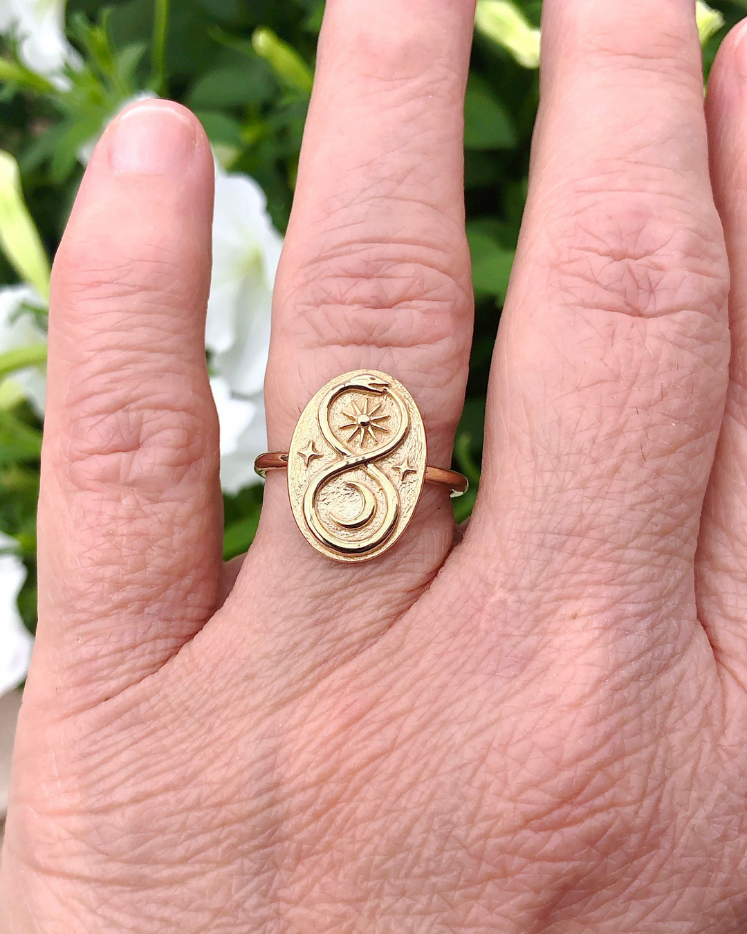 Bronze Ouroboros Ring on ring finger