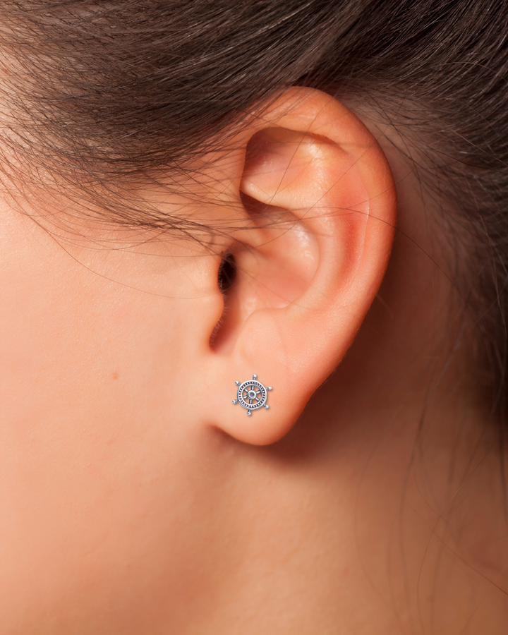 Helm Sterling Silver Earring on an ear.