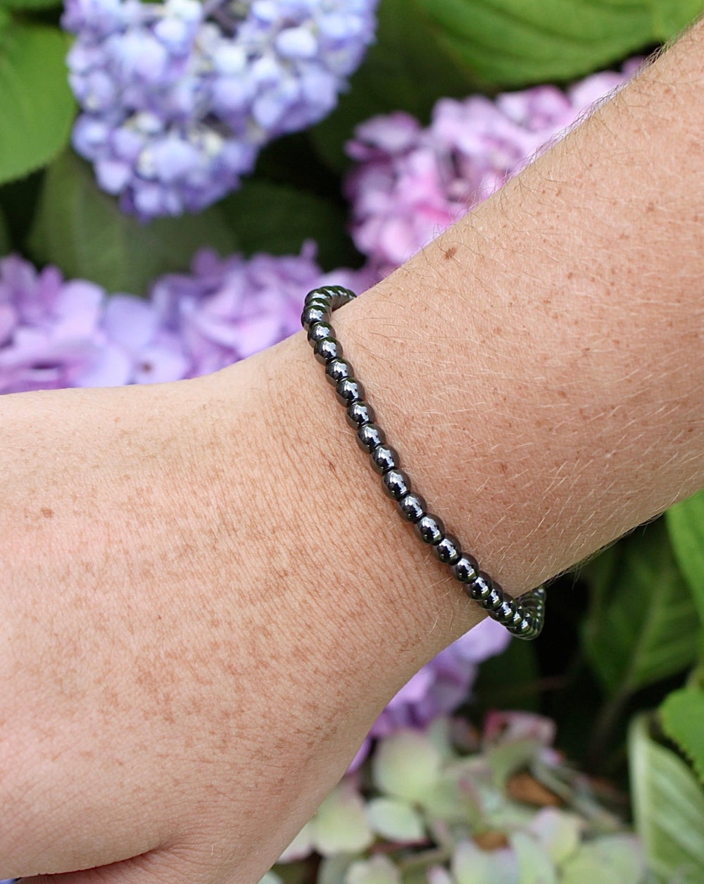 Hematite 4mm Beaded Gemstone Bracelet on a wrist