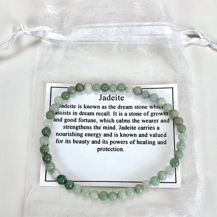 Jadeite 4mm Beaded Gemstone Bracelet with a description card.