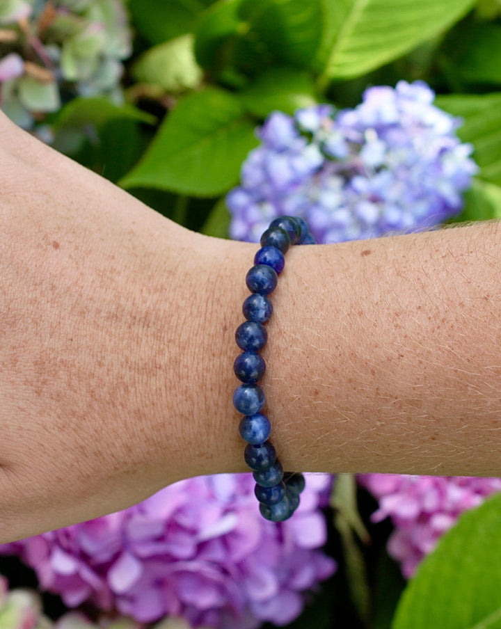 Lapis Lazuli 6mm Beaded Gemstone Bracelet on a wrist