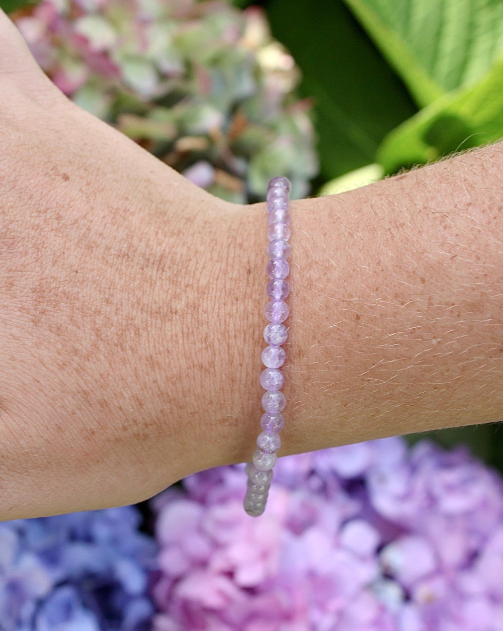 Lavender Amethyst 4mm Beaded Gemstone Bracelet on a wrist.