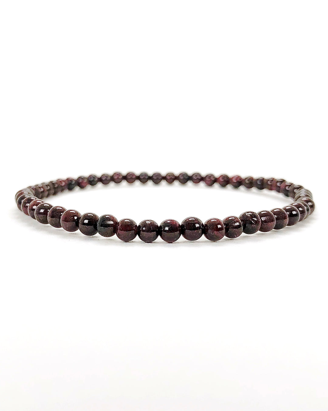 Men's Garnet 4mm Beaded Gemstone Bracelet on a wide Background