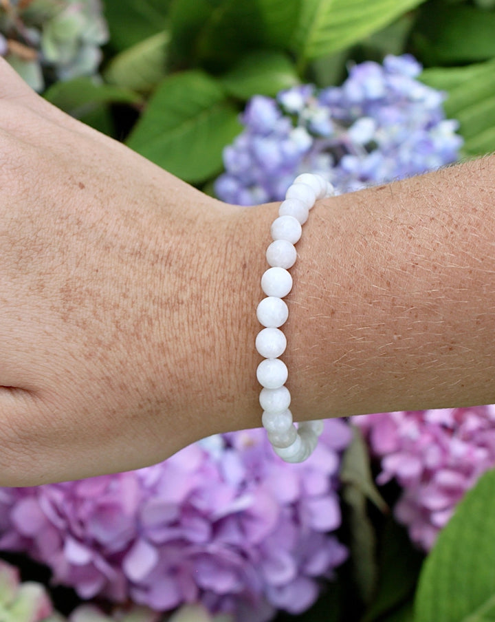 Moonstone 6mm Beaded Gemstone Bracelet on a wrist