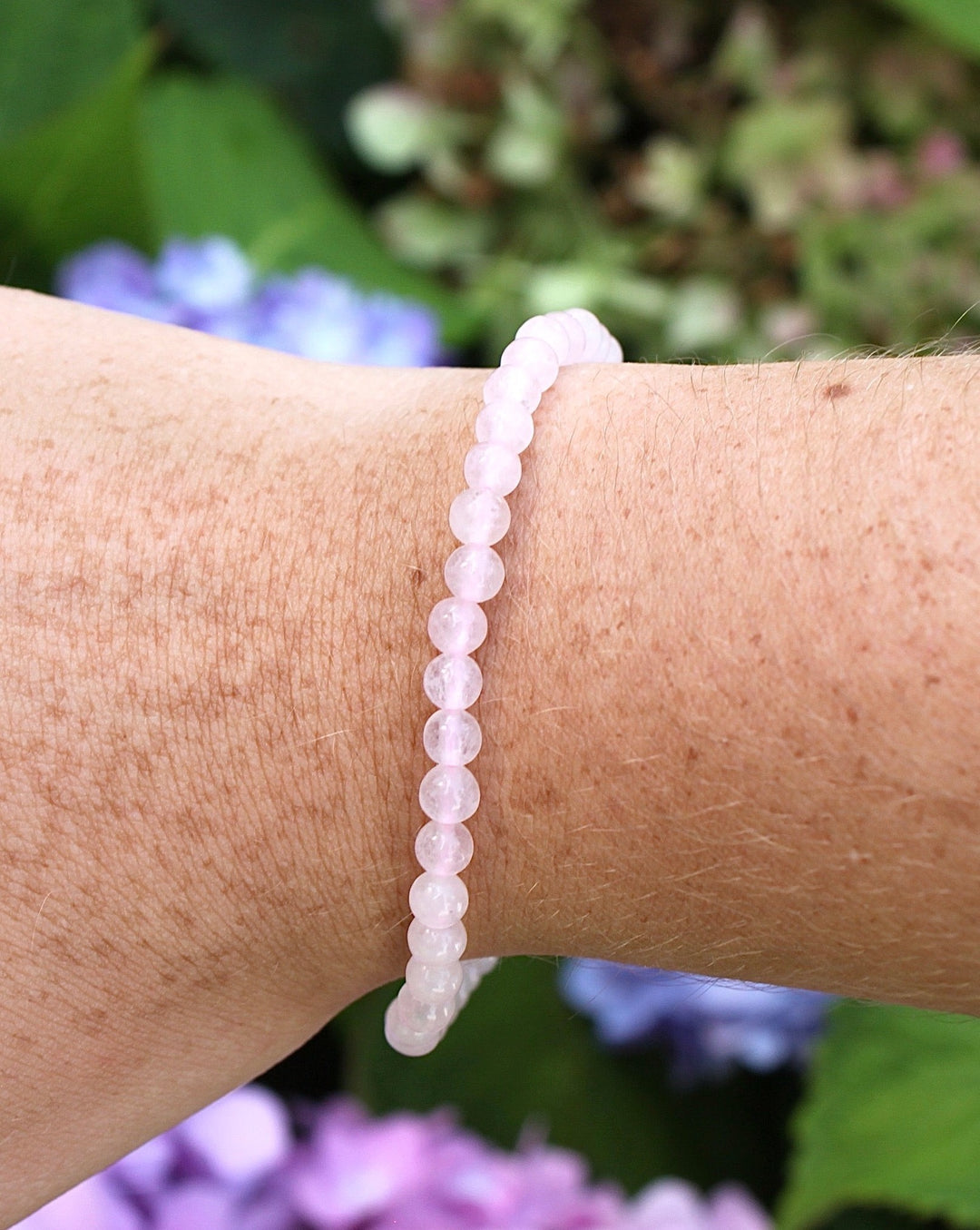 Morganite 4mm Beaded Gemstone Bracelet on a wrist.