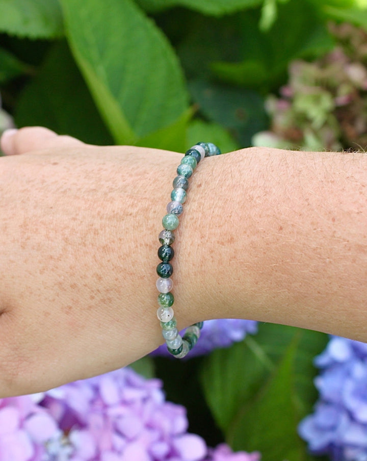 Children's Moss Agate Mini 4mm Gemstone Bracelet on a wrist