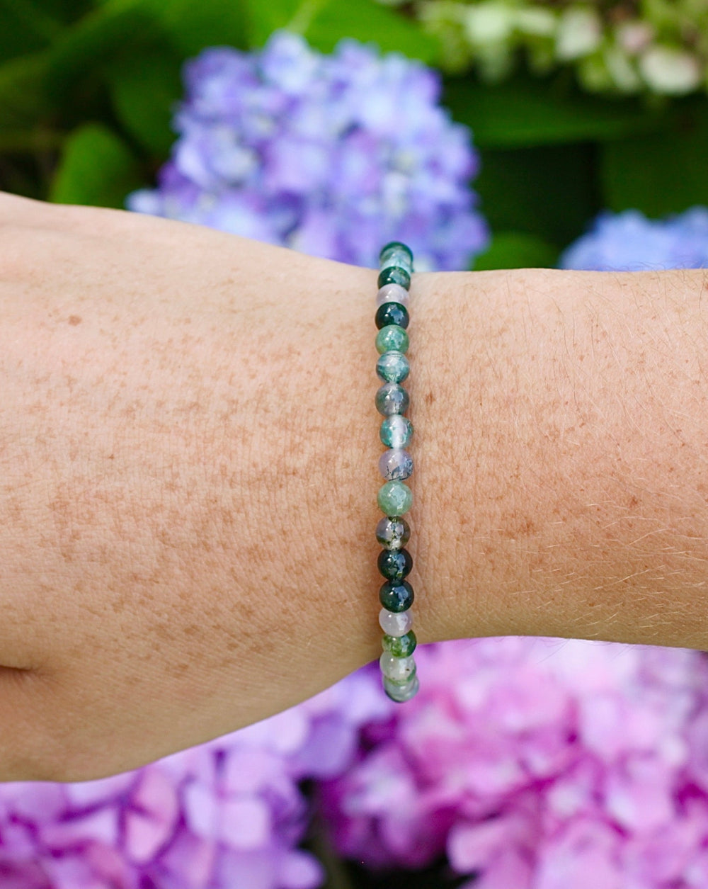 Moss Agate 4mm Beaded Gemstone Bracelet on a wrist.