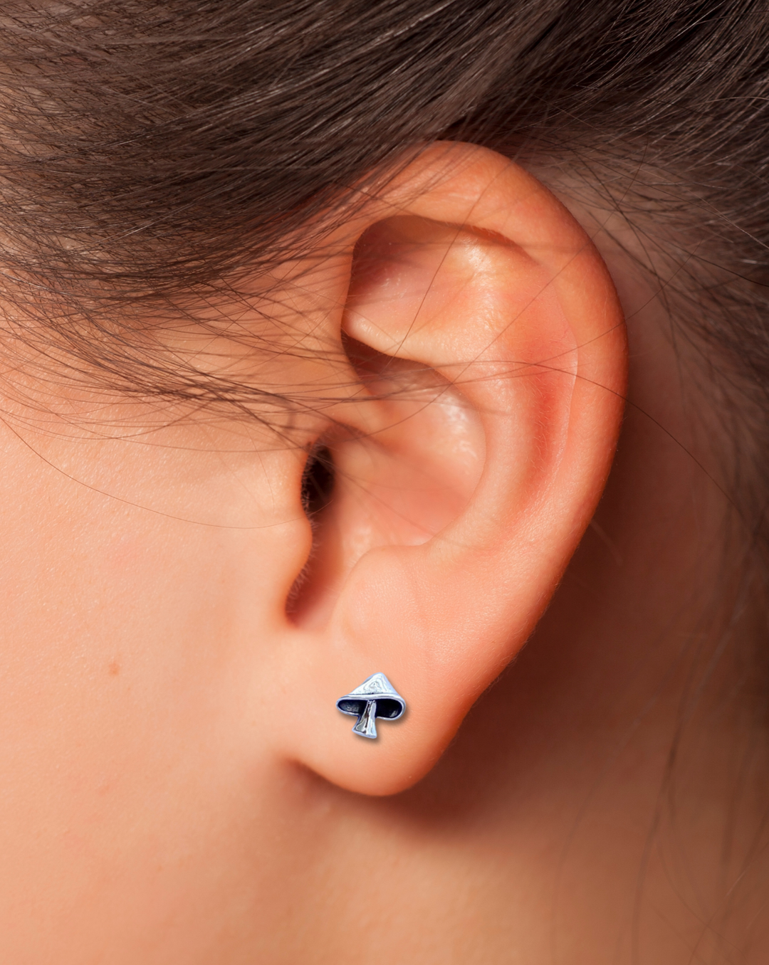 Mushroom Sterling Silver Earring on an Ear.