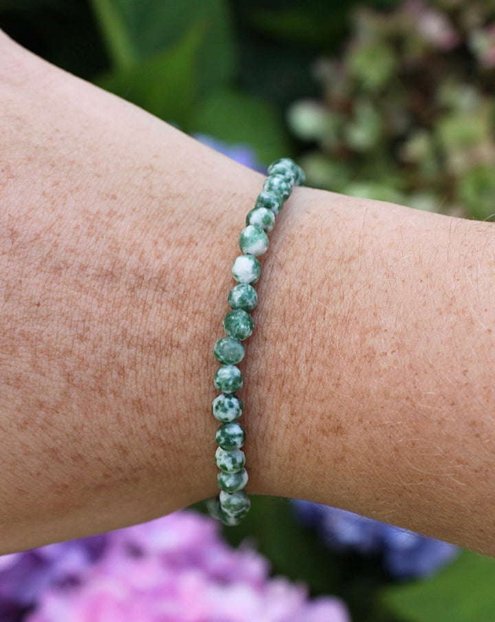 Natural Green Jade 4mm Beaded Gemstone Bracelet on a wrist