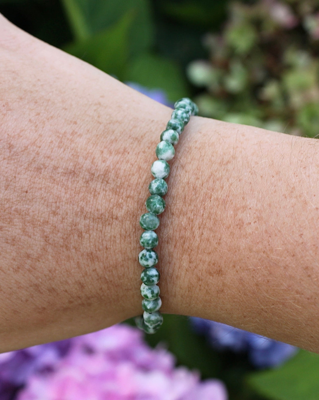 Children's Natural Green Jade 4mm Gemstone Bracelet on a wrist