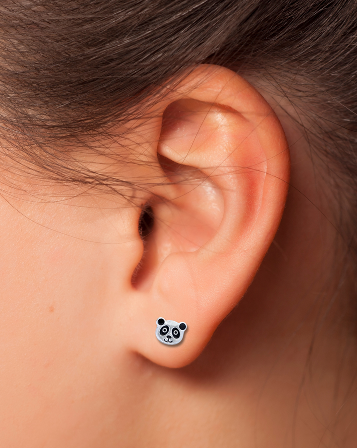 Panda Sterling Silver Earring on an ear.