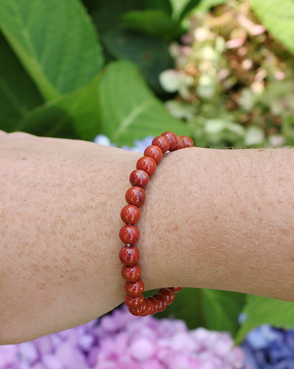 Red Jasper 6mm Beaded Gemstone Bracelet on a wrist